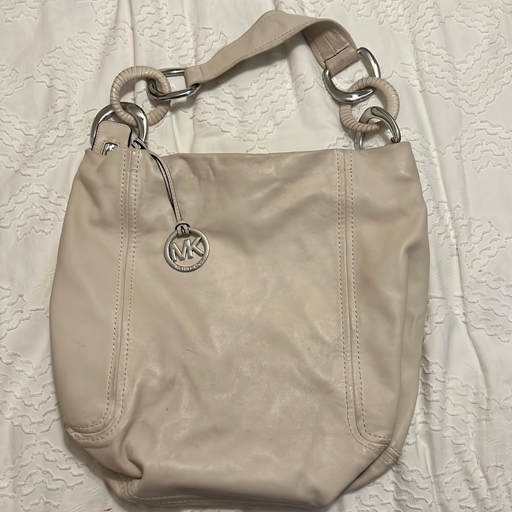 Genuine white leather Michael Kors purse w/ light wear on bottom.Clean interior
